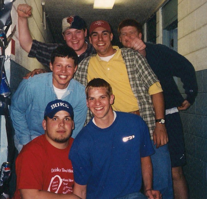 All smiles after sealing off a dorm room with duct tape.